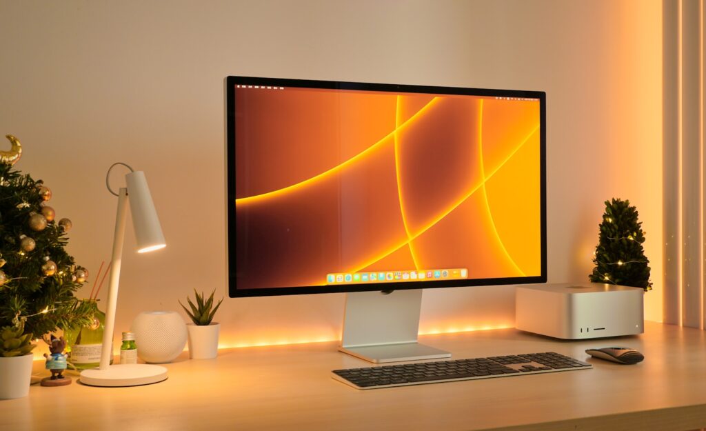 a computer monitor sitting on top of a desk